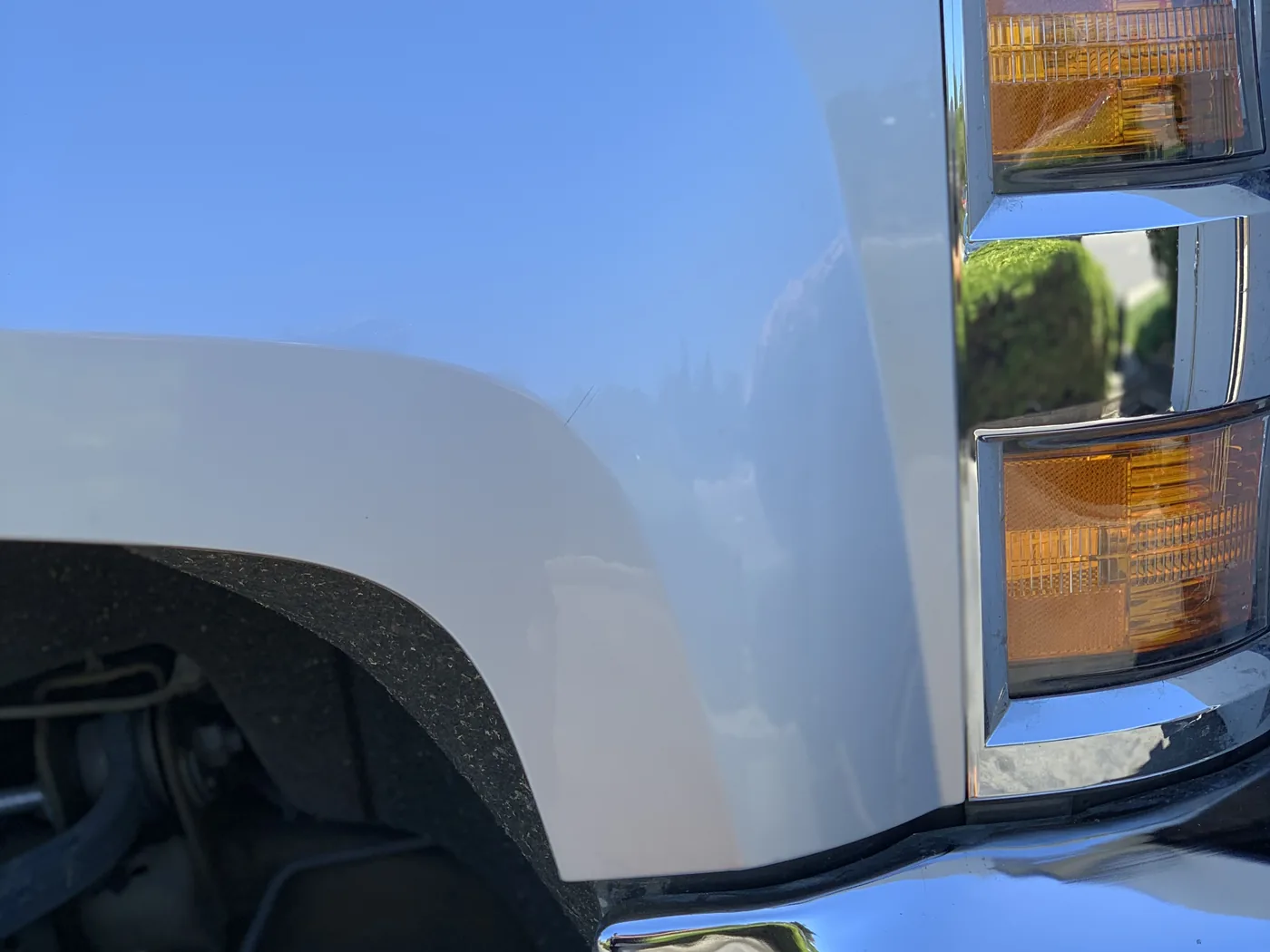 Truck fender after paintless dent repair